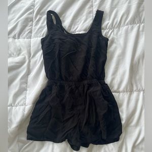 womens black one piece romper / jumper with open criss cross back